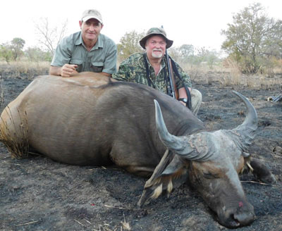 Dyason (left) and Slater with his savanah buffalo.